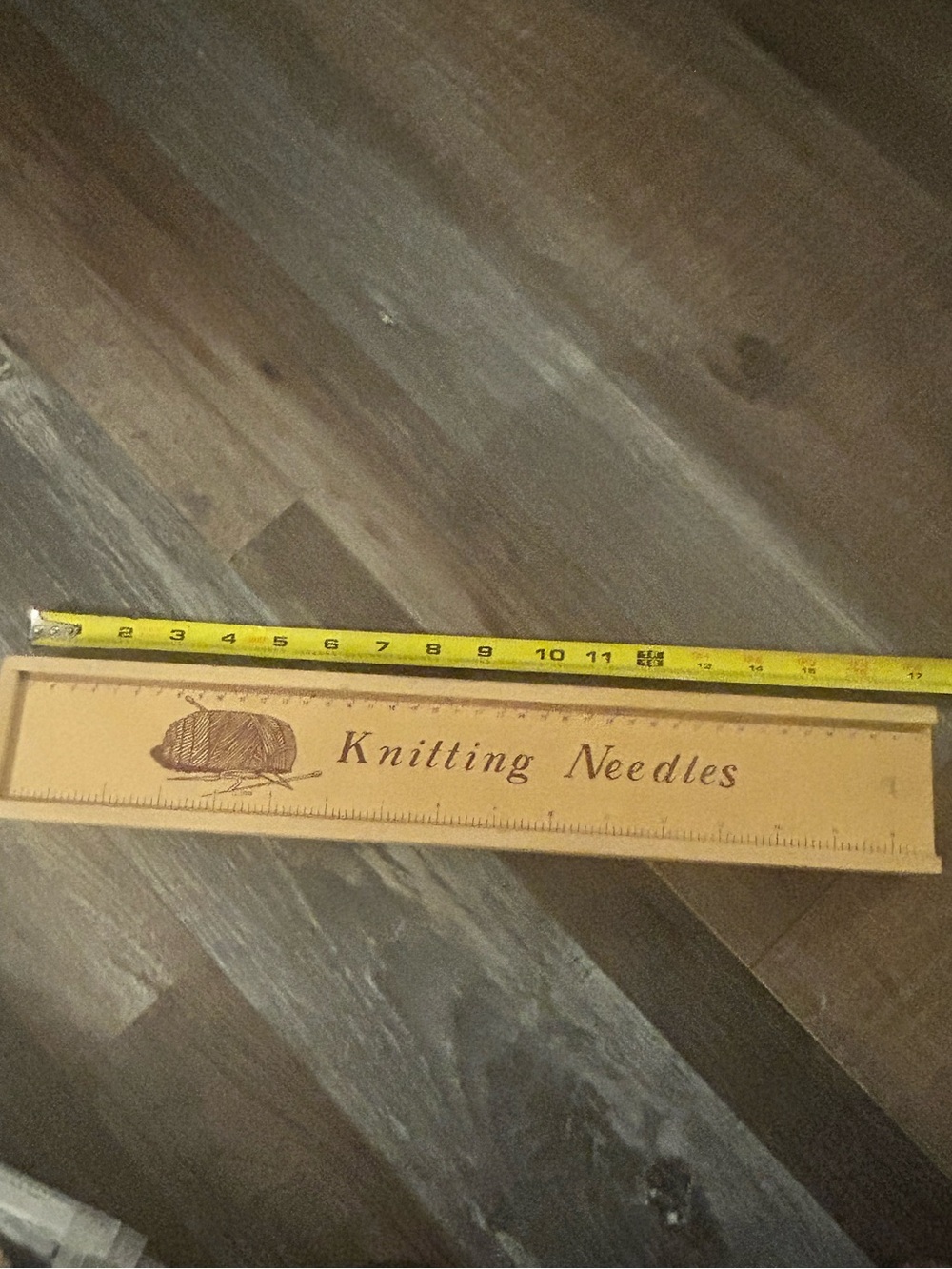 vintage wooden knitting needle storage box with a sliding ruler lid